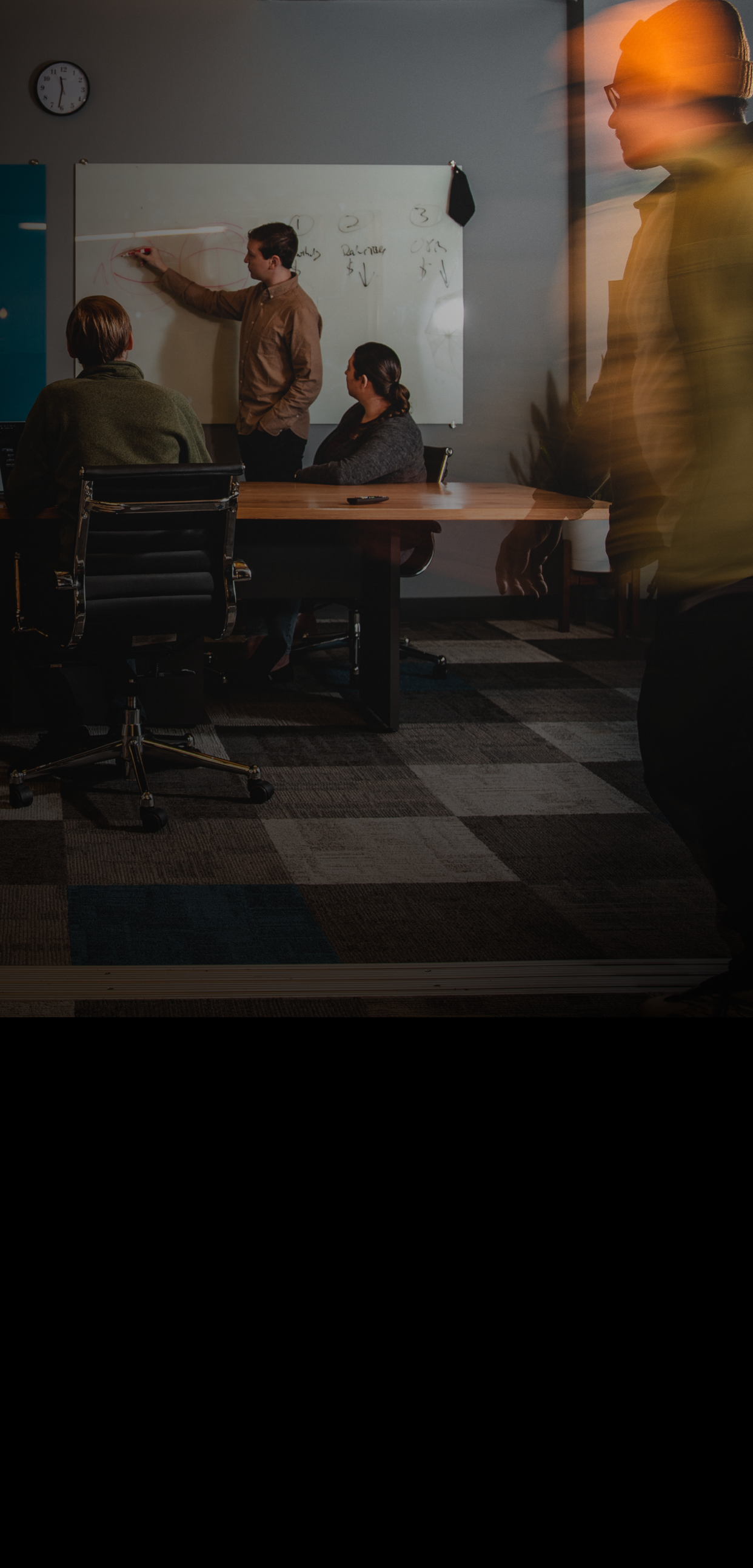 A team of workers in a conference room.