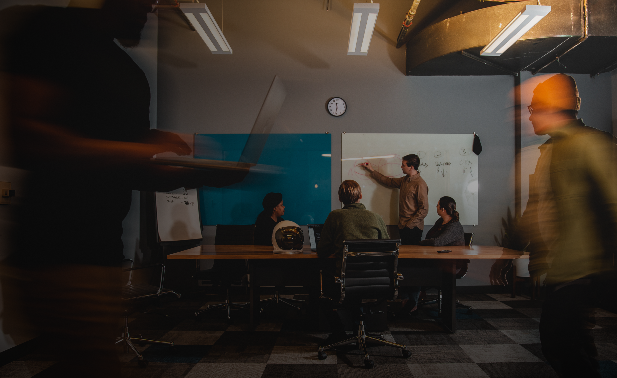 A team of workers in a conference room.